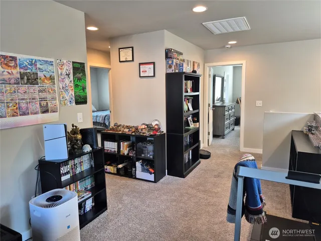 a view of a workspace with furniture and toys