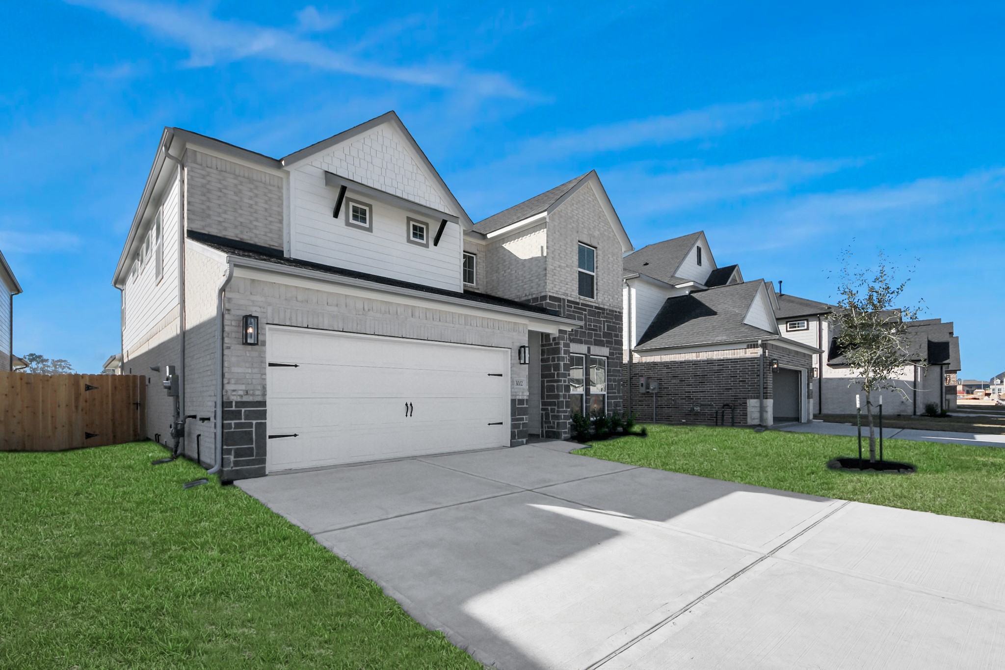 3002 Bury Park Dr Spring Spring, TX 77373 - Photo 2 of 45 Home features a convenient 2-car garage complemented by a spacious driveway, offering ample parking for you and your guests.