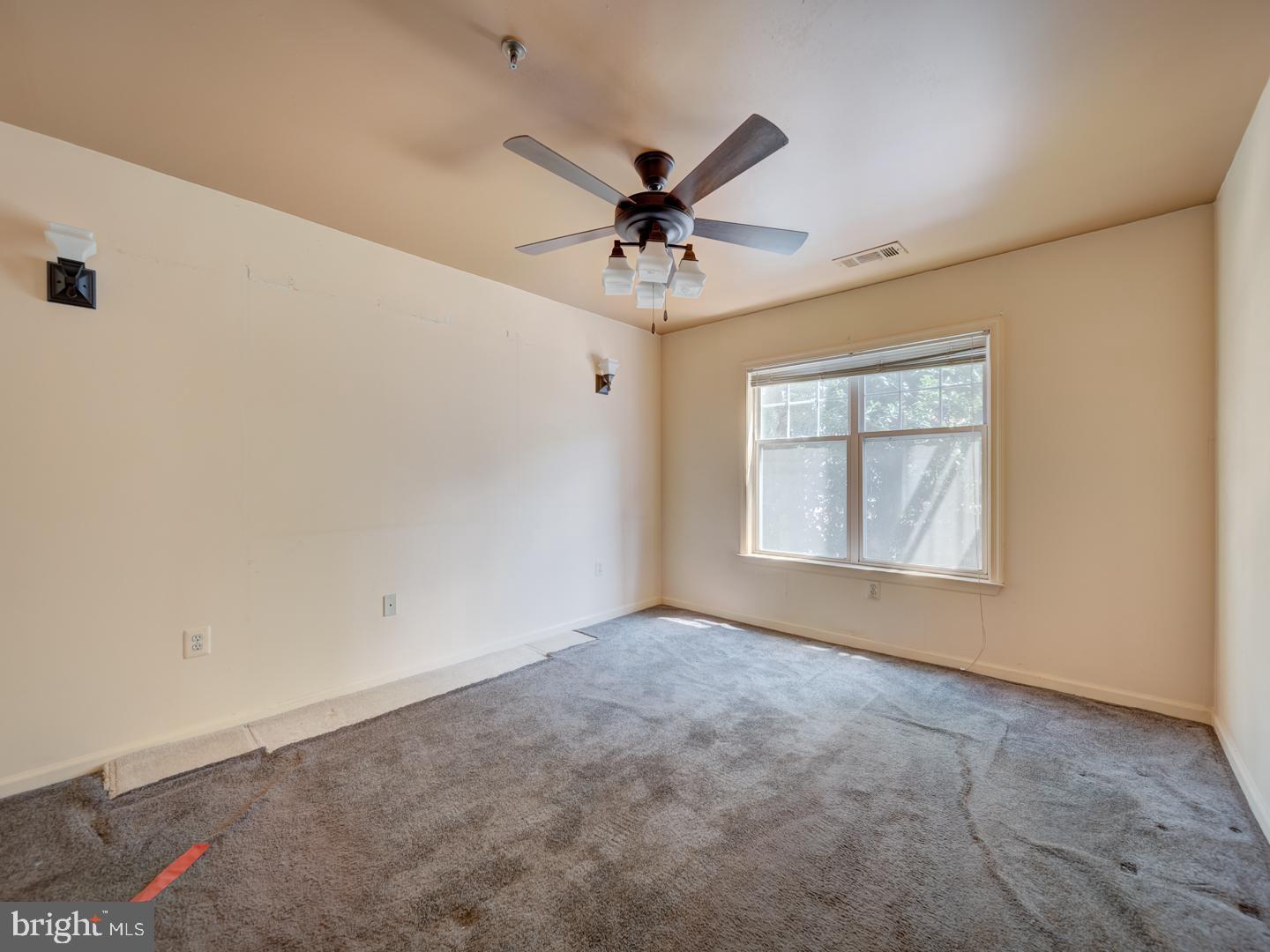 5565 Seminary Road, Unit 214 Falls Church, VA 22041 - Photo 16 of 28 an empty room with windows and ceiling fan