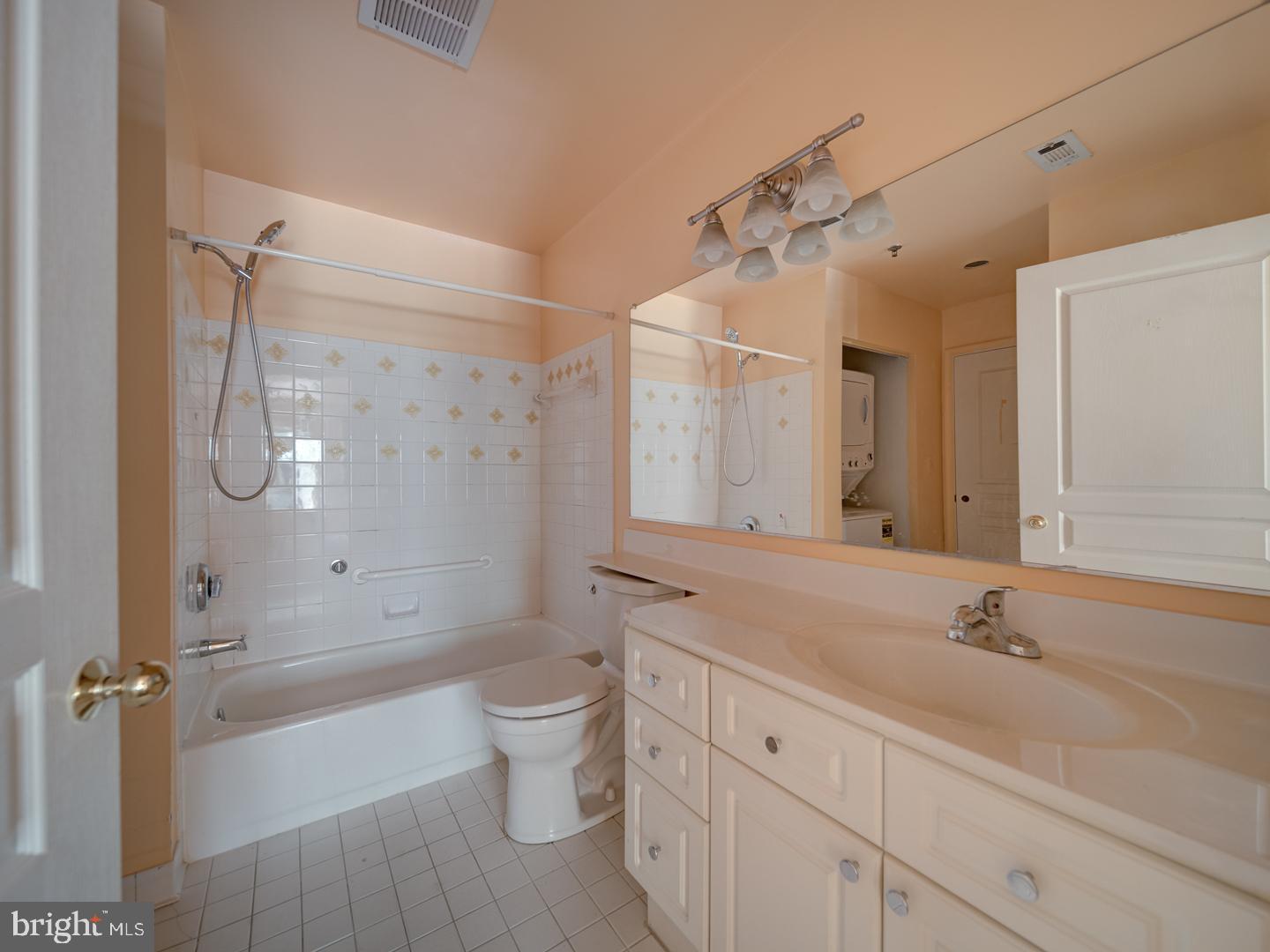5565 Seminary Road, Unit 214 Falls Church, VA 22041 - Photo 21 of 28 a bathroom with a double vanity sink toilet mirror and bathtub