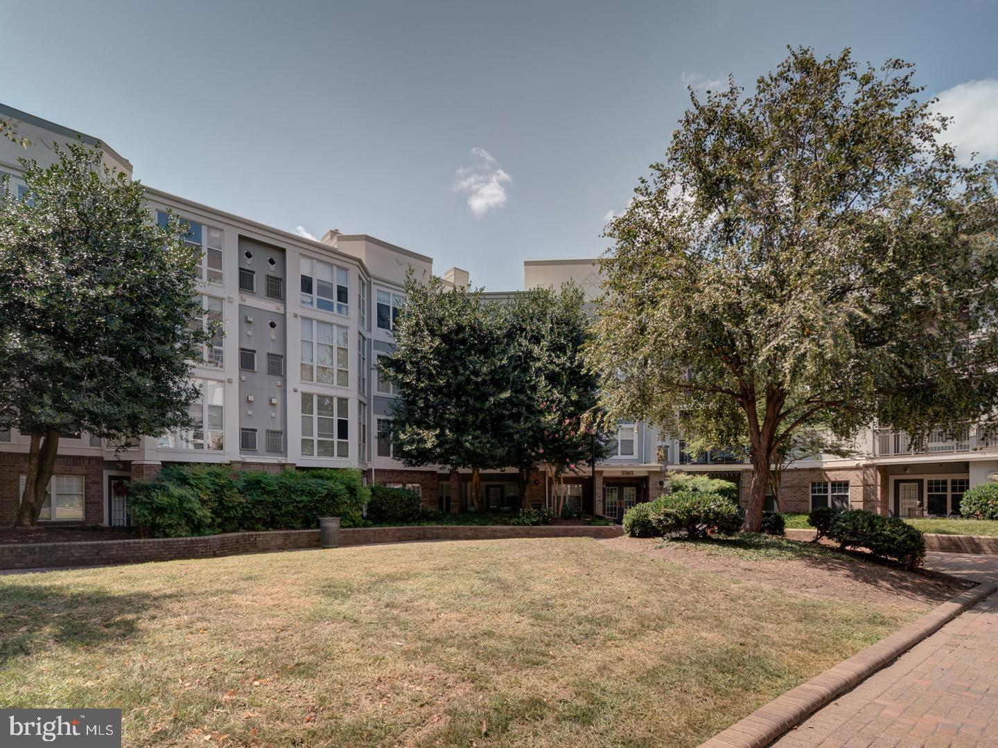5565 Seminary Road, Unit 214 Falls Church, VA 22041 - Photo 3 of 28 a front view of a building with a yard