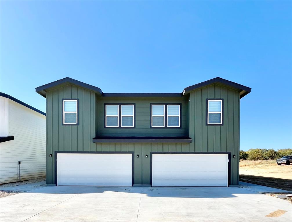 a front view of a house with a garage