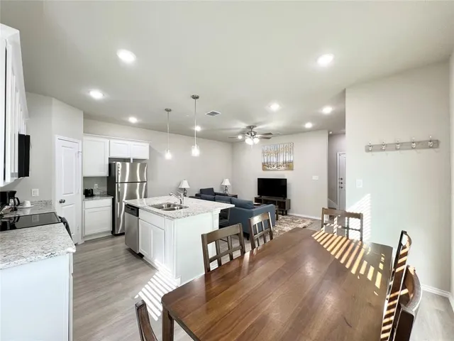 a dining room with furniture and window