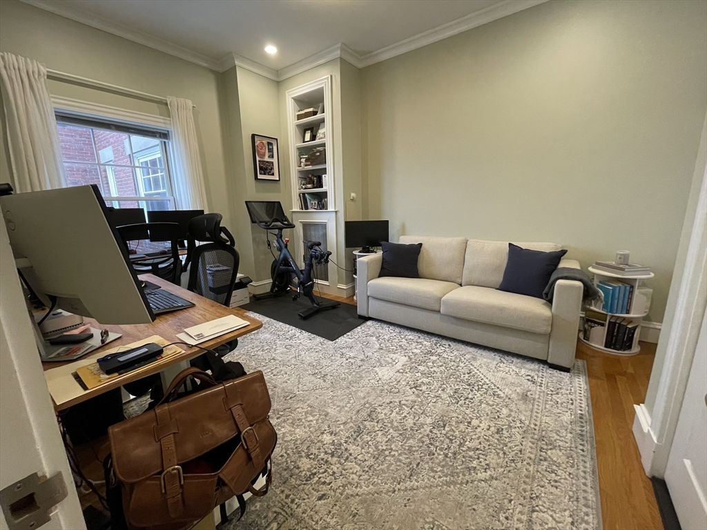 55 Magazine Street, Unit 64 Cambridge, MA 02139 - Photo 11 of 23 a living room with furniture a couch and a piano