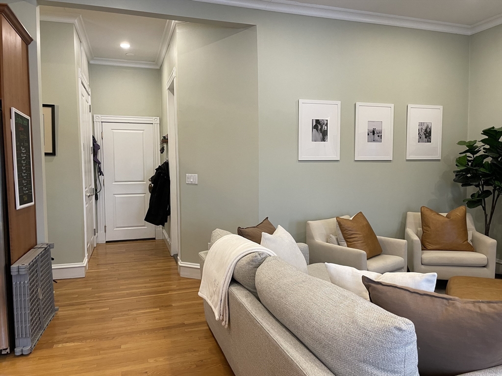 55 Magazine Street, Unit 64 Cambridge, MA 02139 - Photo 4 of 23 a living room with furniture and a rug