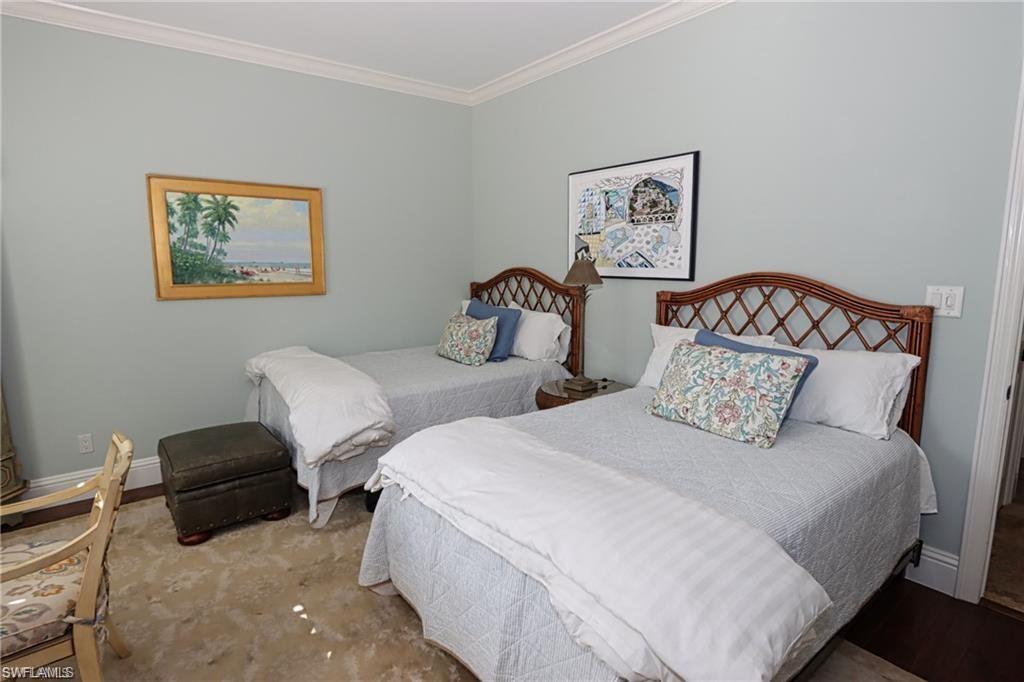 2201 Beacon Lane Naples, FL 34103 - Photo 15 of 34 a bedroom with two beds and painting on the wall