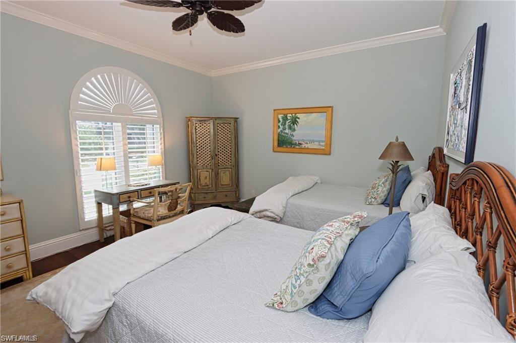 2201 Beacon Lane Naples, FL 34103 - Photo 16 of 34 a bedroom with bed and a window