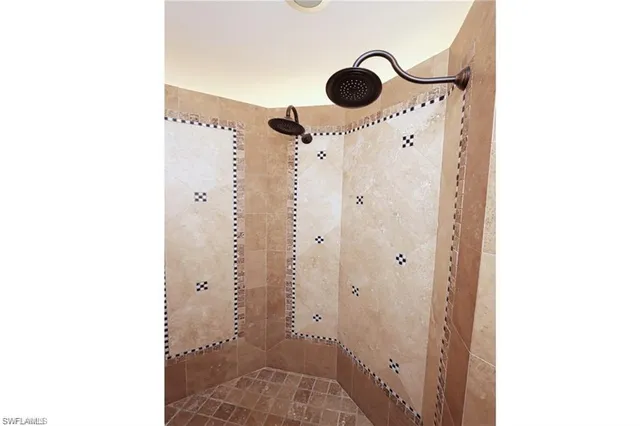 a bathroom with a shower and a mirror