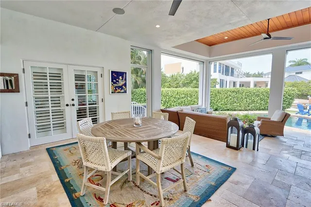 a view of a dining room with furniture window and outside view