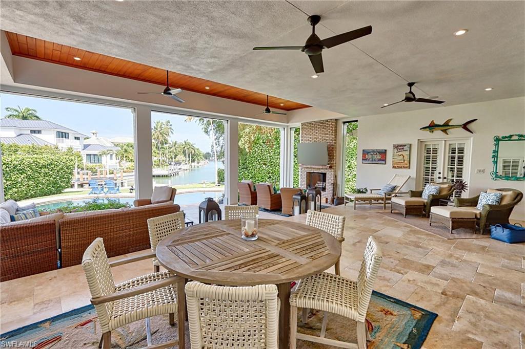 2201 Beacon Lane Naples, FL 34103 - Photo 28 of 34 a view of a dining room with furniture window and outside view