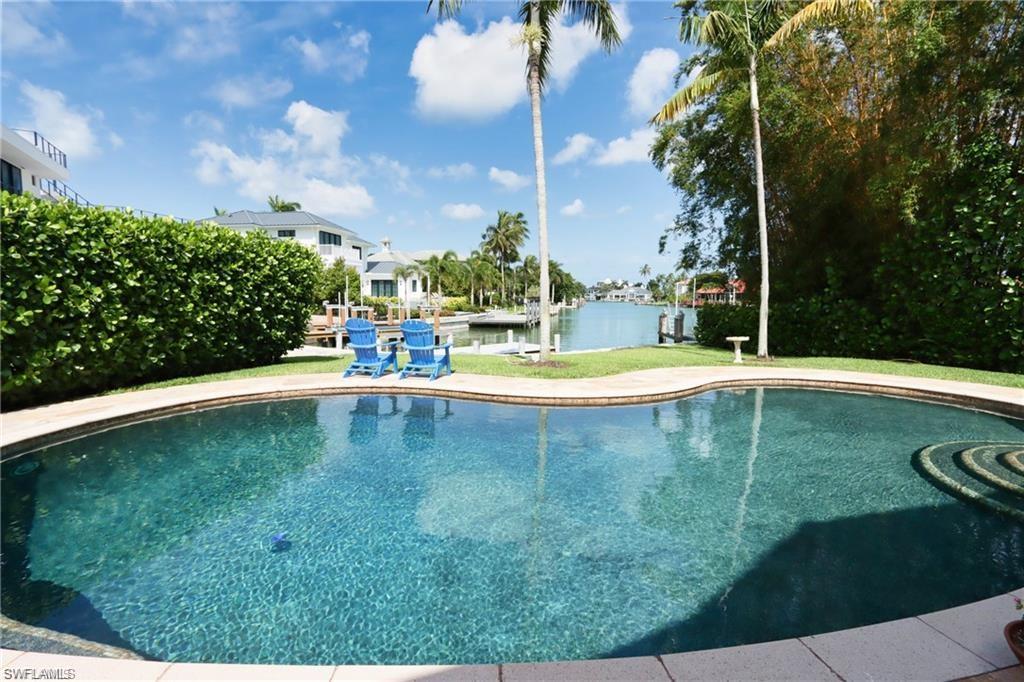 2201 Beacon Lane Naples, FL 34103 - Photo 31 of 34 a view of swimming pool with a yard