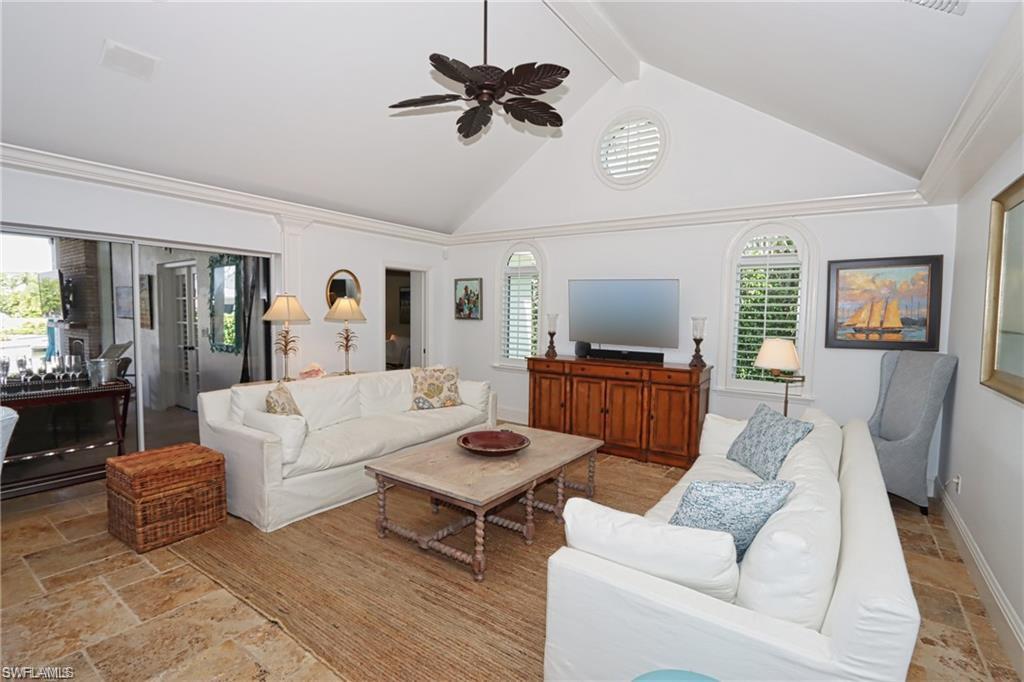 2201 Beacon Lane Naples, FL 34103 - Photo 5 of 34 a living room with furniture and a flat screen tv