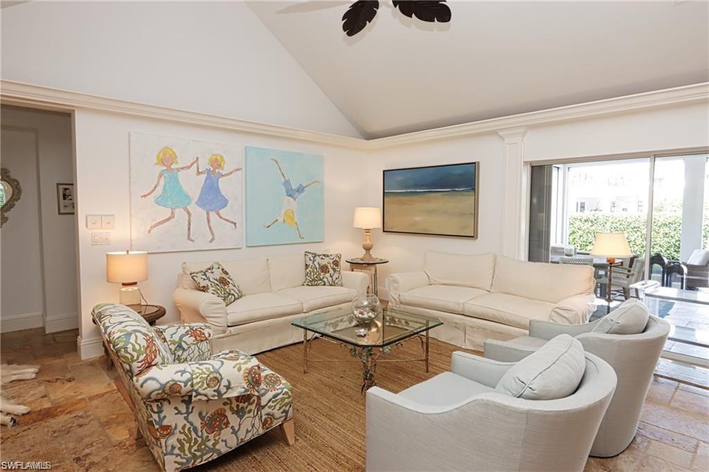 2201 Beacon Lane Naples, FL 34103 - Photo 7 of 34 a living room with furniture and a large window