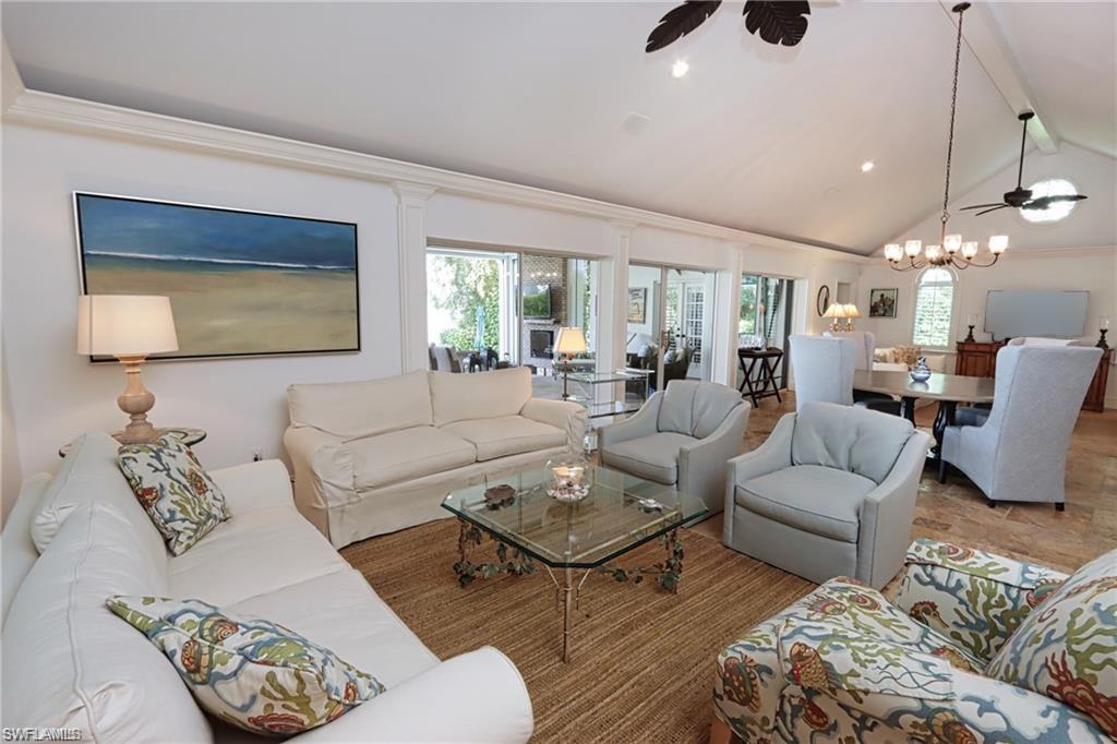 2201 Beacon Lane Naples, FL 34103 - Photo 8 of 34 a living room with furniture and a large window