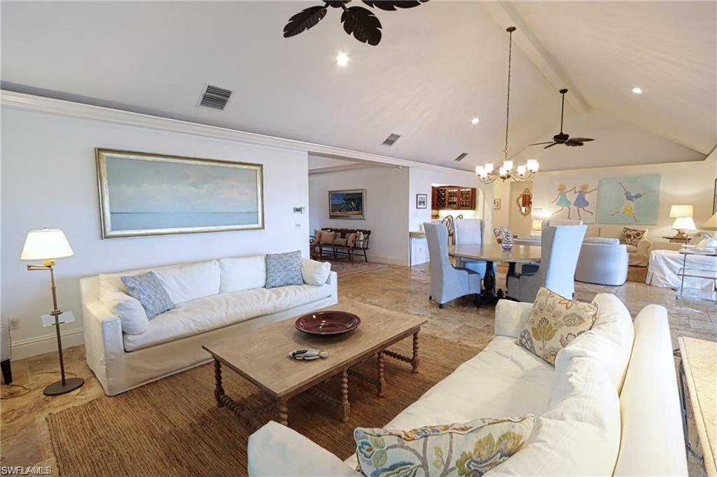 2201 Beacon Lane Naples, FL 34103 - Photo 9 of 34 a living room with furniture and wooden floor