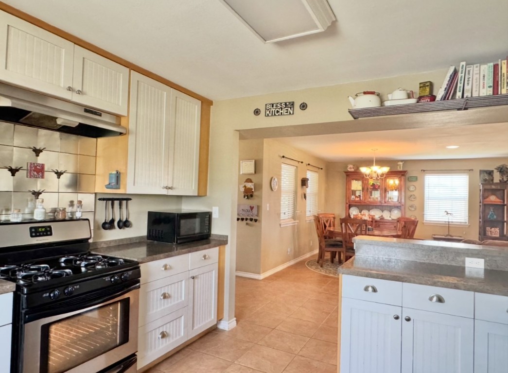2334 County Road 464 Elgin, TX 78621 - Photo 14 of 39 a kitchen with stainless steel appliances a stove a sink and a refrigerator