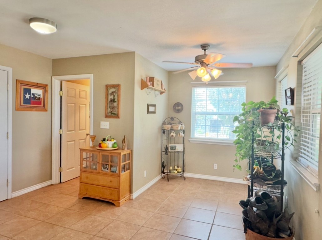 2334 County Road 464 Elgin, TX 78621 - Photo 19 of 39 Foyer featuring ceiling fan and light tile patterned floors