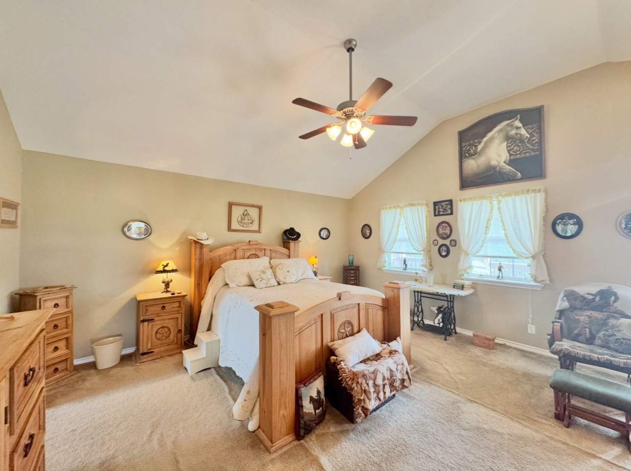 2334 County Road 464 Elgin, TX 78621 - Photo 22 of 39 a bed room with a bed and a chandelier