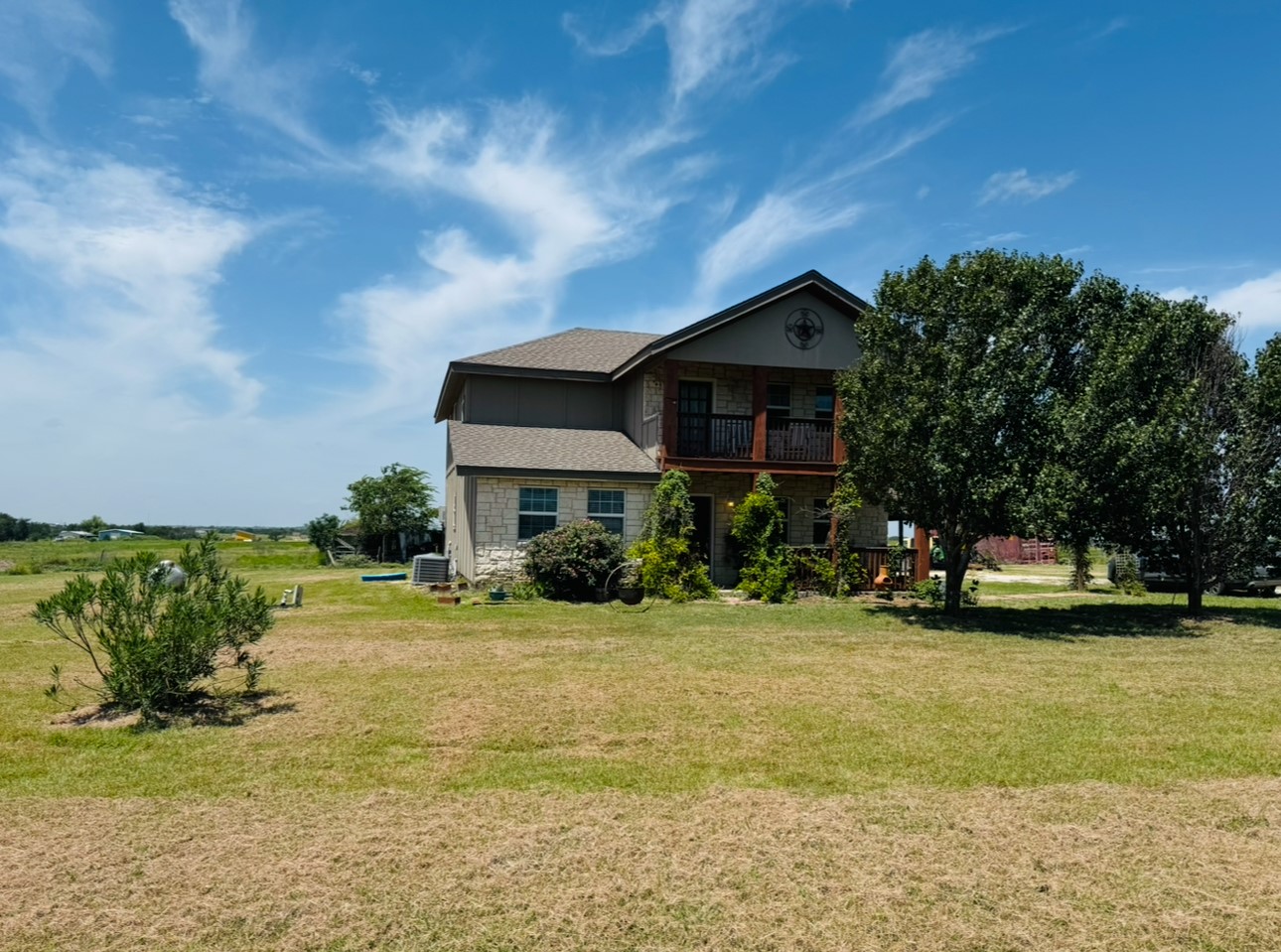 2334 County Road 464 Elgin, TX 78621 - Photo 30 of 39 a view of a house with a yard and sitting area