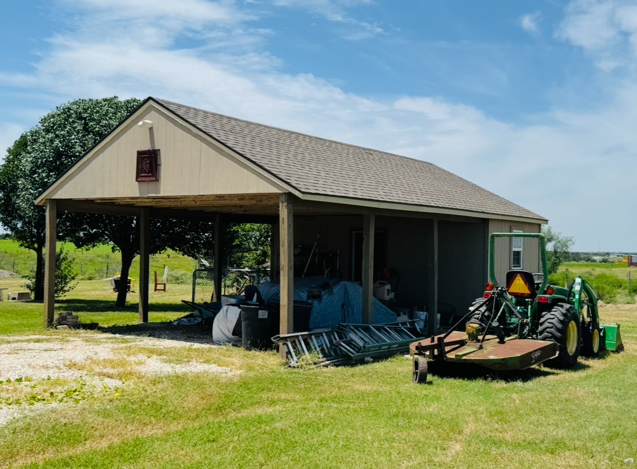 2334 County Road 464 Elgin, TX 78621 - Photo 33 of 39 a front view of a house with porch and garden