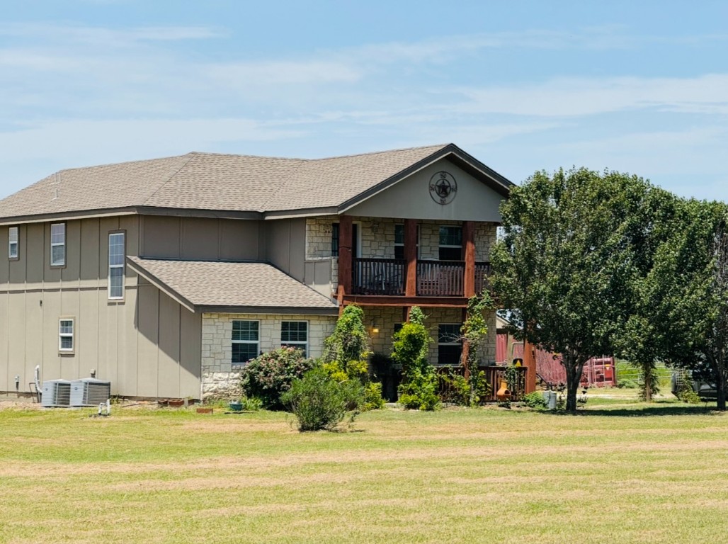 2334 County Road 464 Elgin, TX 78621 - Photo 4 of 39 a front view of a house with a yard
