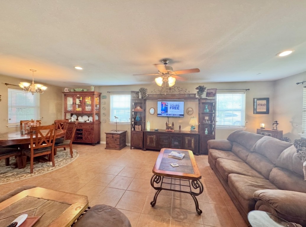 2334 County Road 464 Elgin, TX 78621 - Photo 6 of 39 Living area featuring recessed lighting, a chandelier, healthy amount of natural light, ceiling fan, and light tile patterned floors