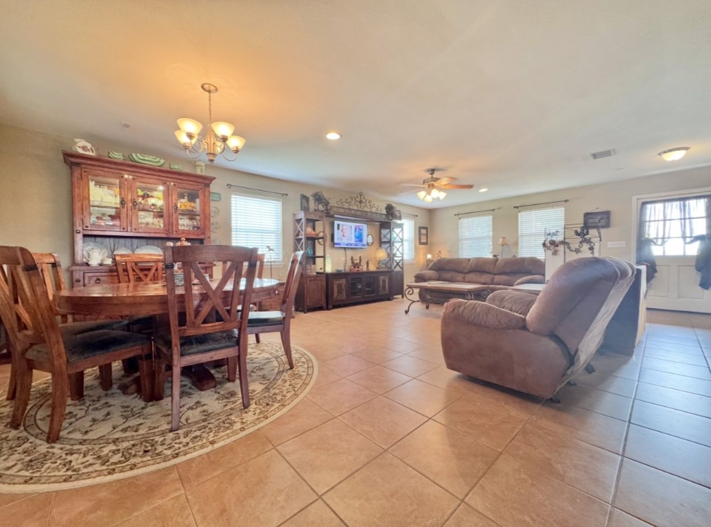 2334 County Road 464 Elgin, TX 78621 - Photo 7 of 39 a living room with furniture a dining table and a dining table