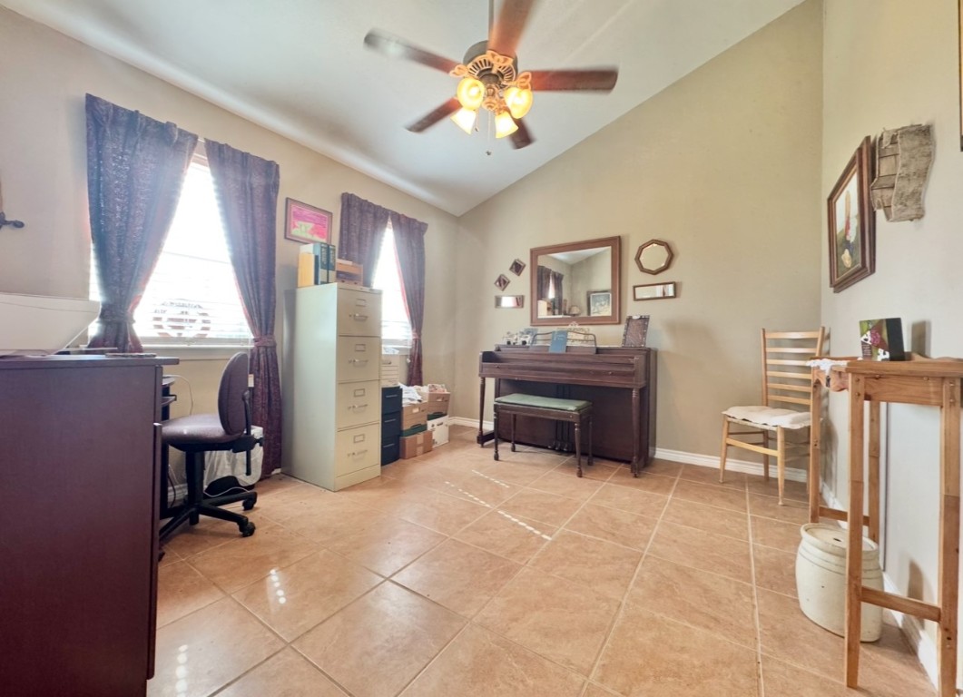 2334 County Road 464 Elgin, TX 78621 - Photo 8 of 39 Office space featuring a ceiling fan, lofted ceiling, and light tile patterned floors