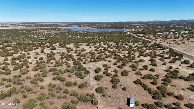 an aerial view of residential houses with city view