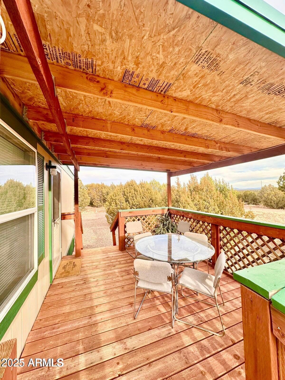 8102 White Mountain Lake Road Show Low, AZ 85901 - Photo 3 of 8 a view of a balcony with wooden floor