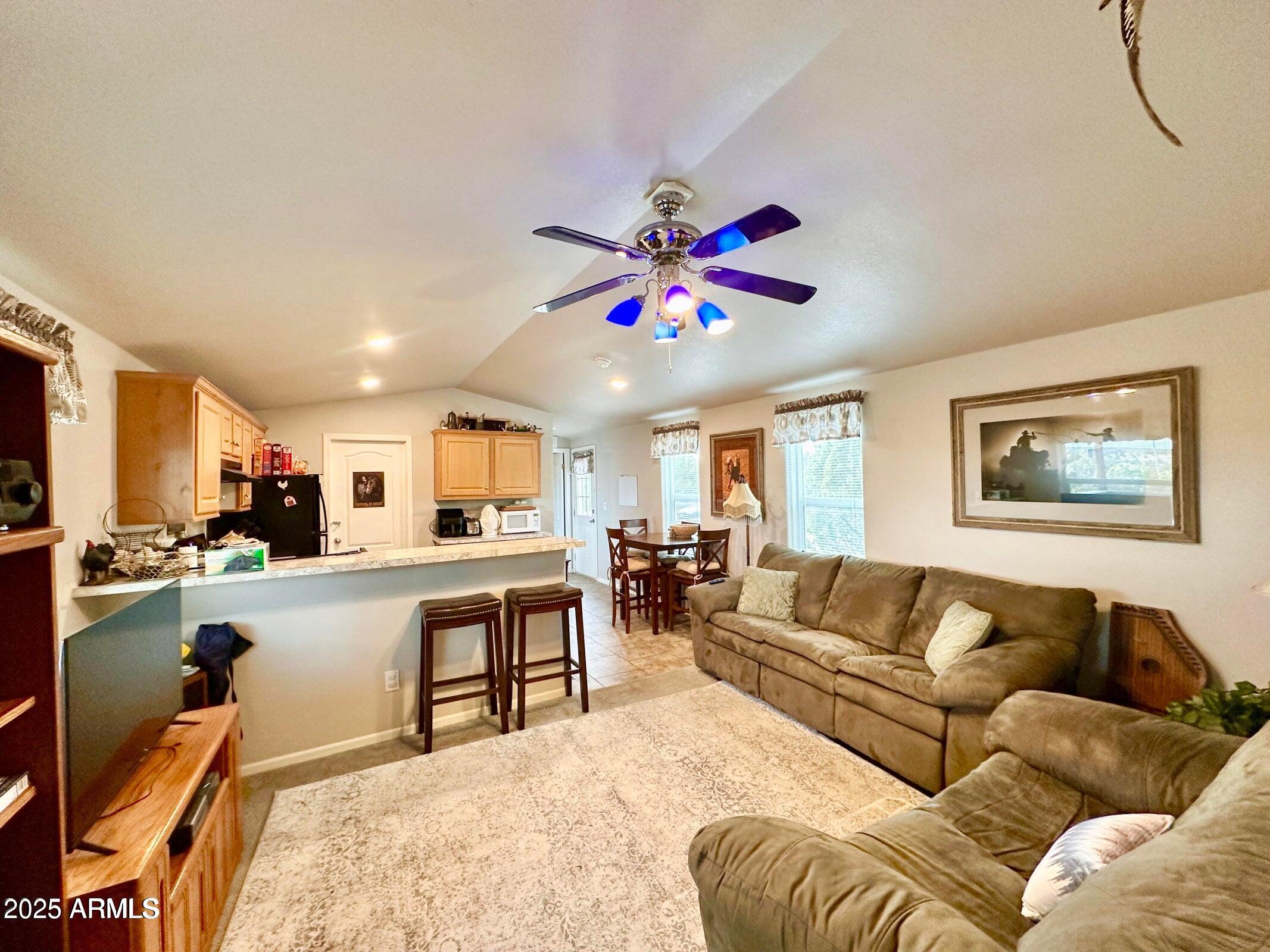 8102 White Mountain Lake Road Show Low, AZ 85901 - Photo 4 of 8 a living room with furniture and kitchen view