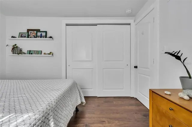 a bedroom with a bed and a cabinets