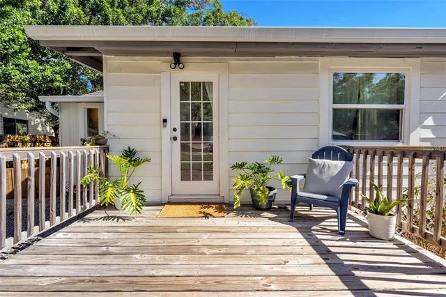 a view of a chair and table in the balcony