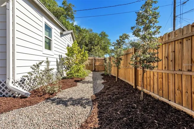 a backyard of a house with lots of green space