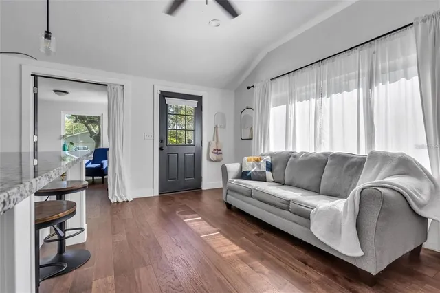 a living room with furniture and a large window