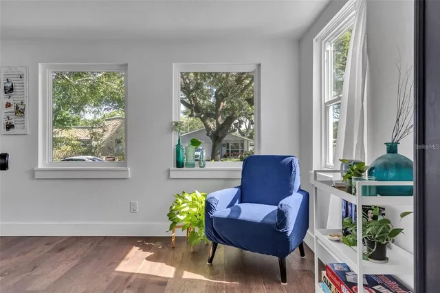 a living room with furniture and a window