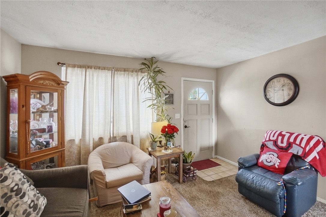 4780 Old Salem Road Englewood, OH 45322 - Photo 5 of 30 This living room provides a comfortable and inviting atmosphere for everyday living.