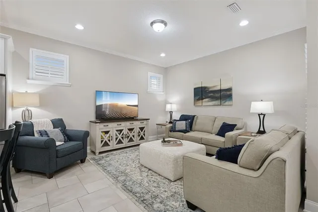 a dining room with furniture and entryway
