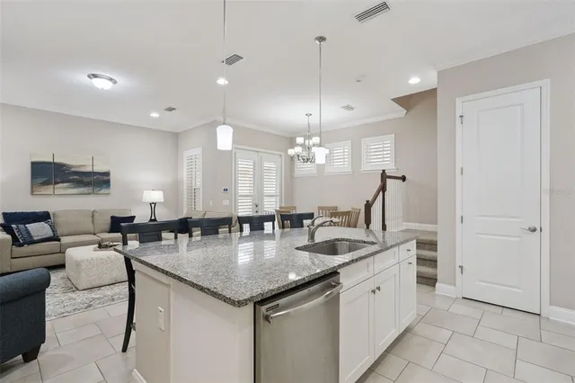 a bedroom with a bed and a lamp