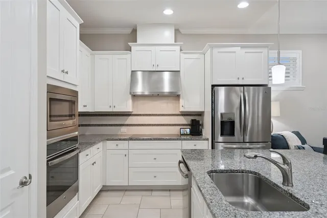 a spacious bathroom with a double vanity sink a mirror and a shower