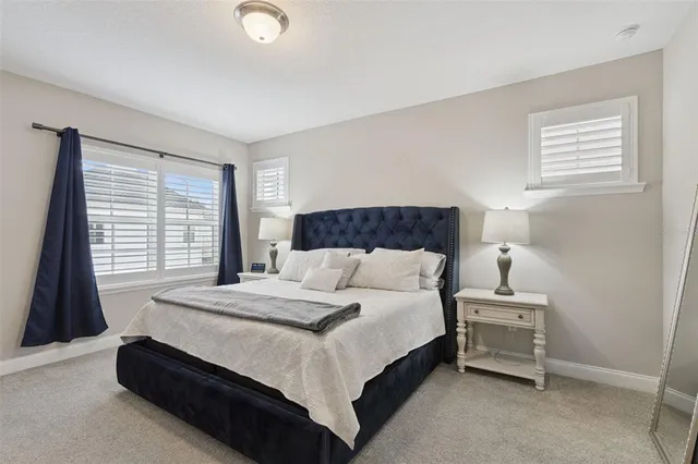 a bedroom with furniture and a window