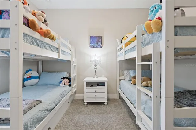 an aerial view of a house with a lake view