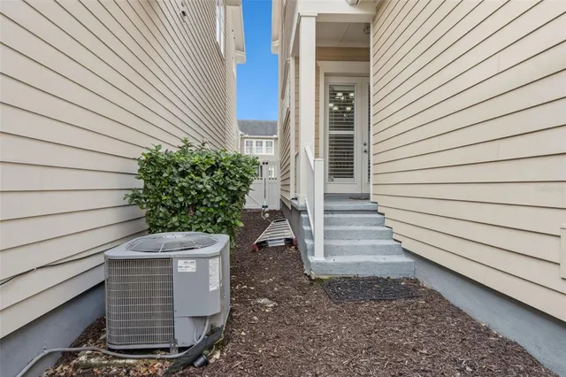 a view of multiple houses with palm trees
