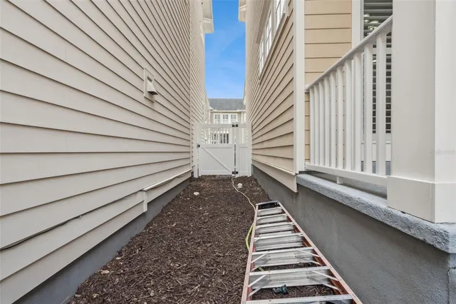 an aerial view of a residential houses with outdoor space