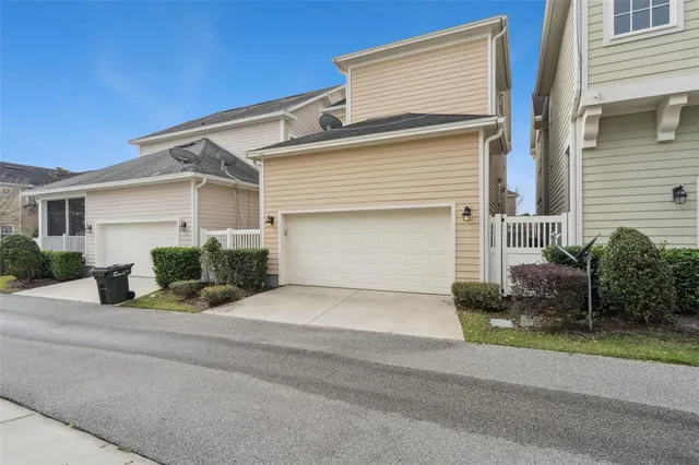 an aerial view of residential building and lake