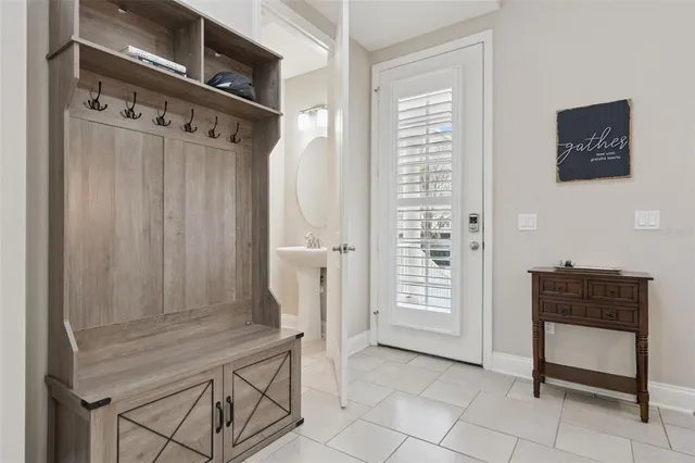 a view of a livingroom with workspace and a window