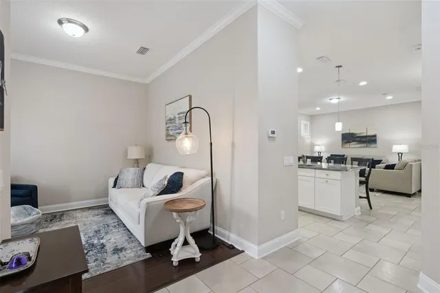 a living room with furniture and a night stand