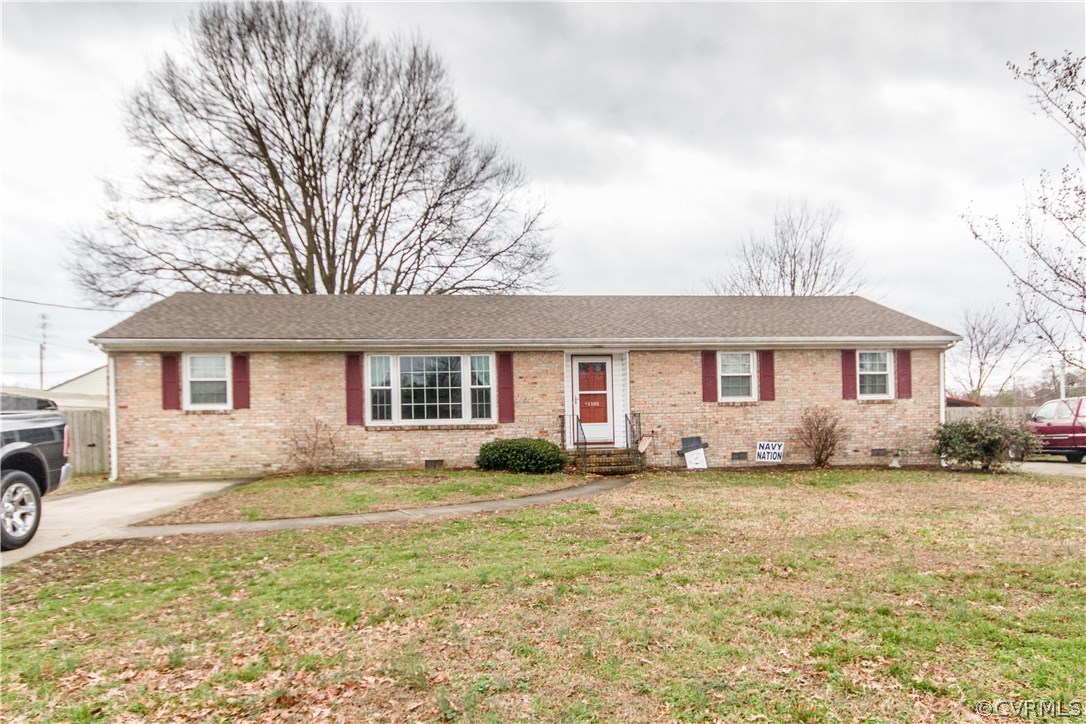 1101 Covington Road Colonial Heights, VA 23834 - Photo 1 of 47 a front view of a house with a yard