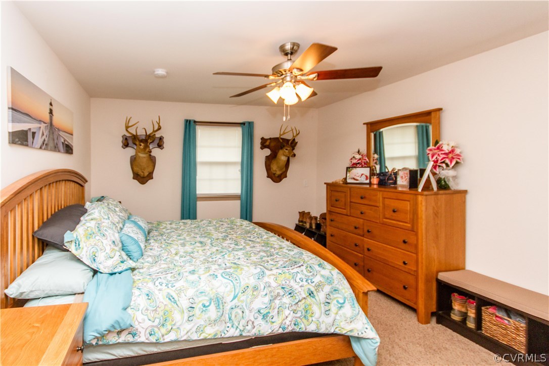 1101 Covington Road Colonial Heights, VA 23834 - Photo 20 of 47 a bedroom with a bed and dresser with mirror