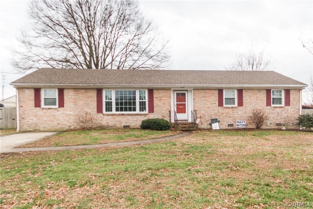 1101 Covington Road Colonial Heights, VA 23834 - Photo 2 of 47 a view of a yard in front of a house